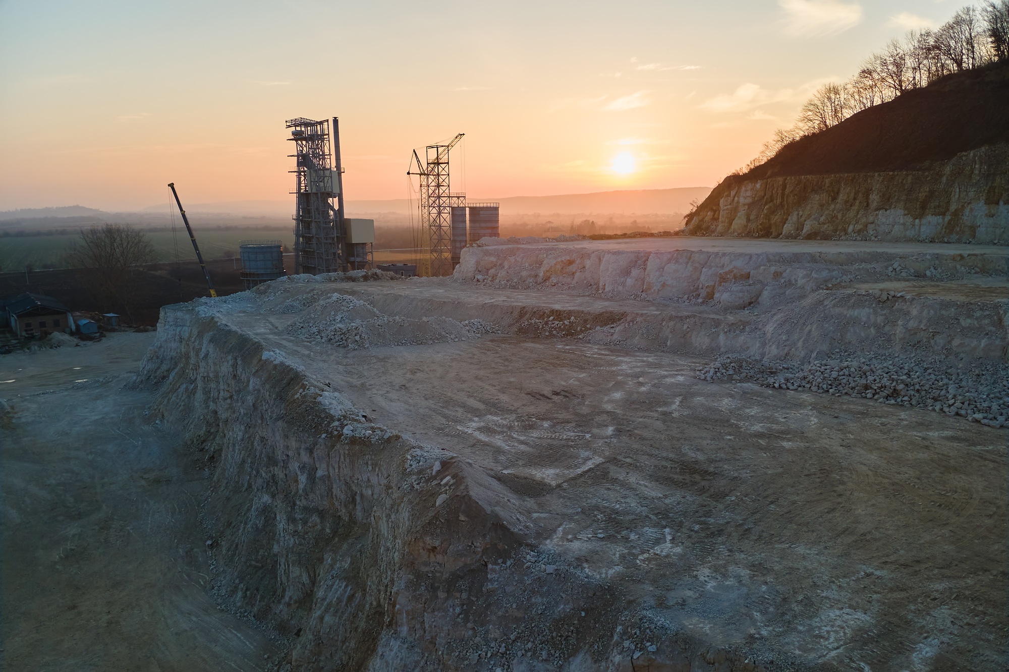 Cement factory at open pit mining of construction sand stone materials. Digging of gravel resources
